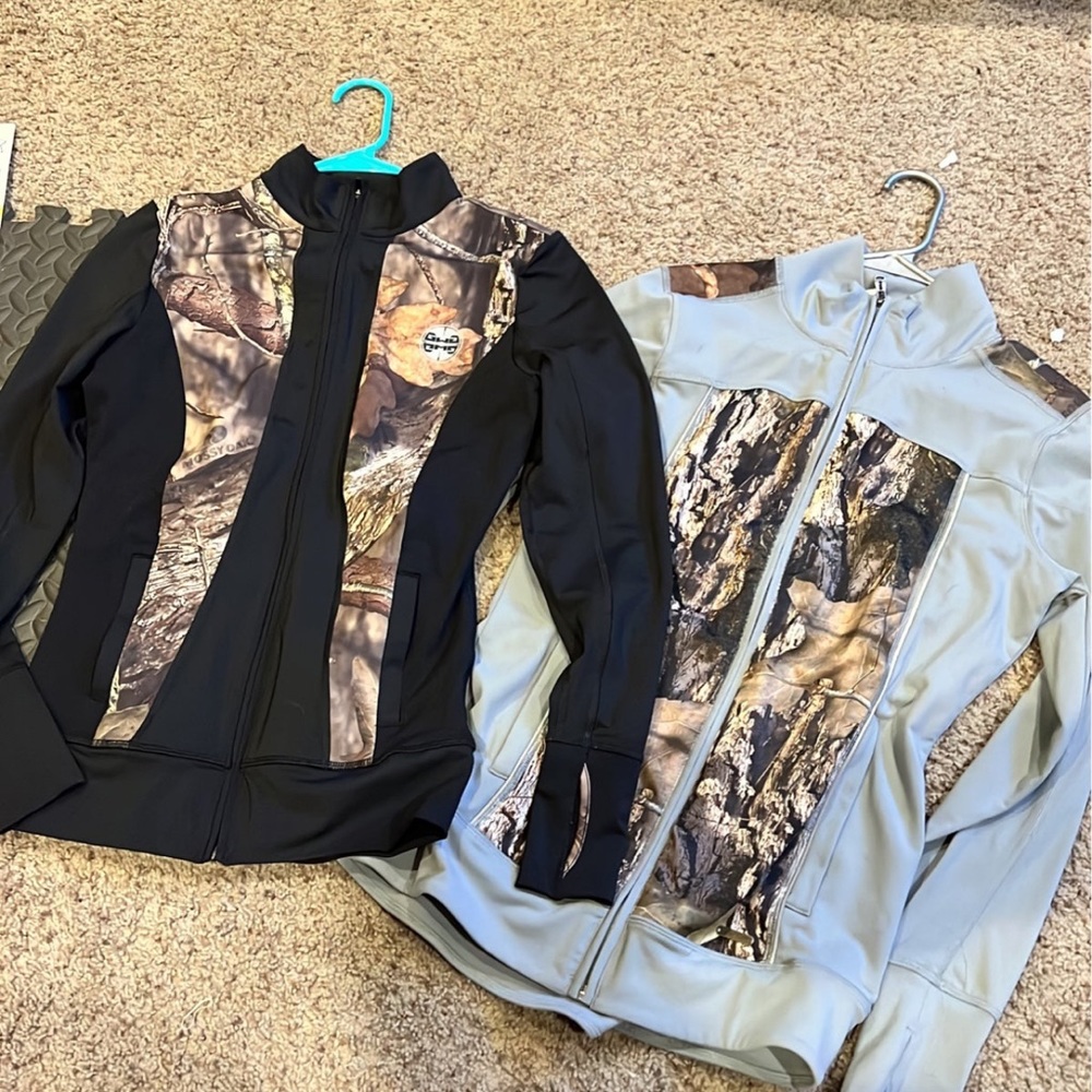 Two girls with guns athletic jackets